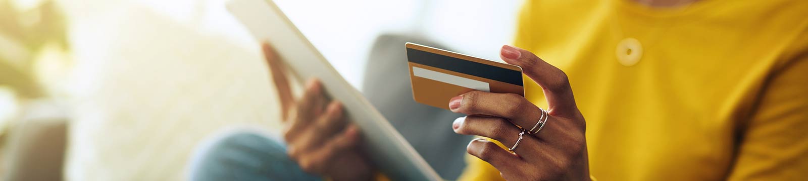 a person making a online purchase with a debit/credit card